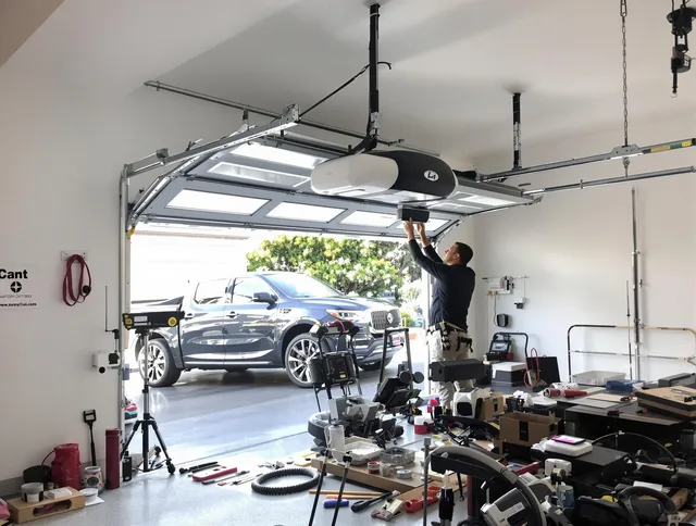 Stanton Garage Door Repair specialist installing smart garage door opener system in Stanton home
