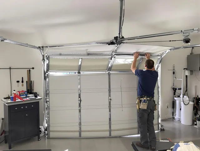 Stanton Garage Door Repair specialist performing precise section replacement on Stanton garage door